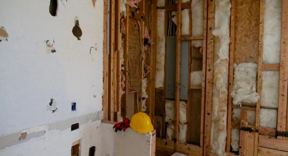 An interior space undergoing reconstruction and demolition for renovation.