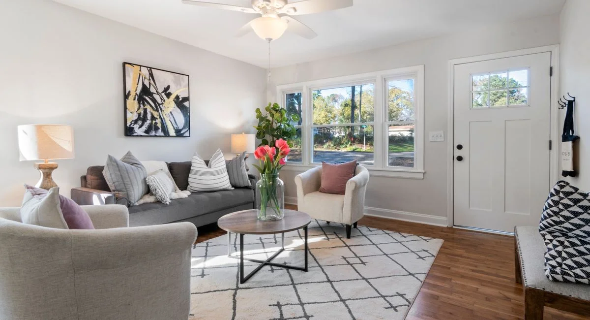 Bright and elegant living room featuring modern decor and cozy furnishings.